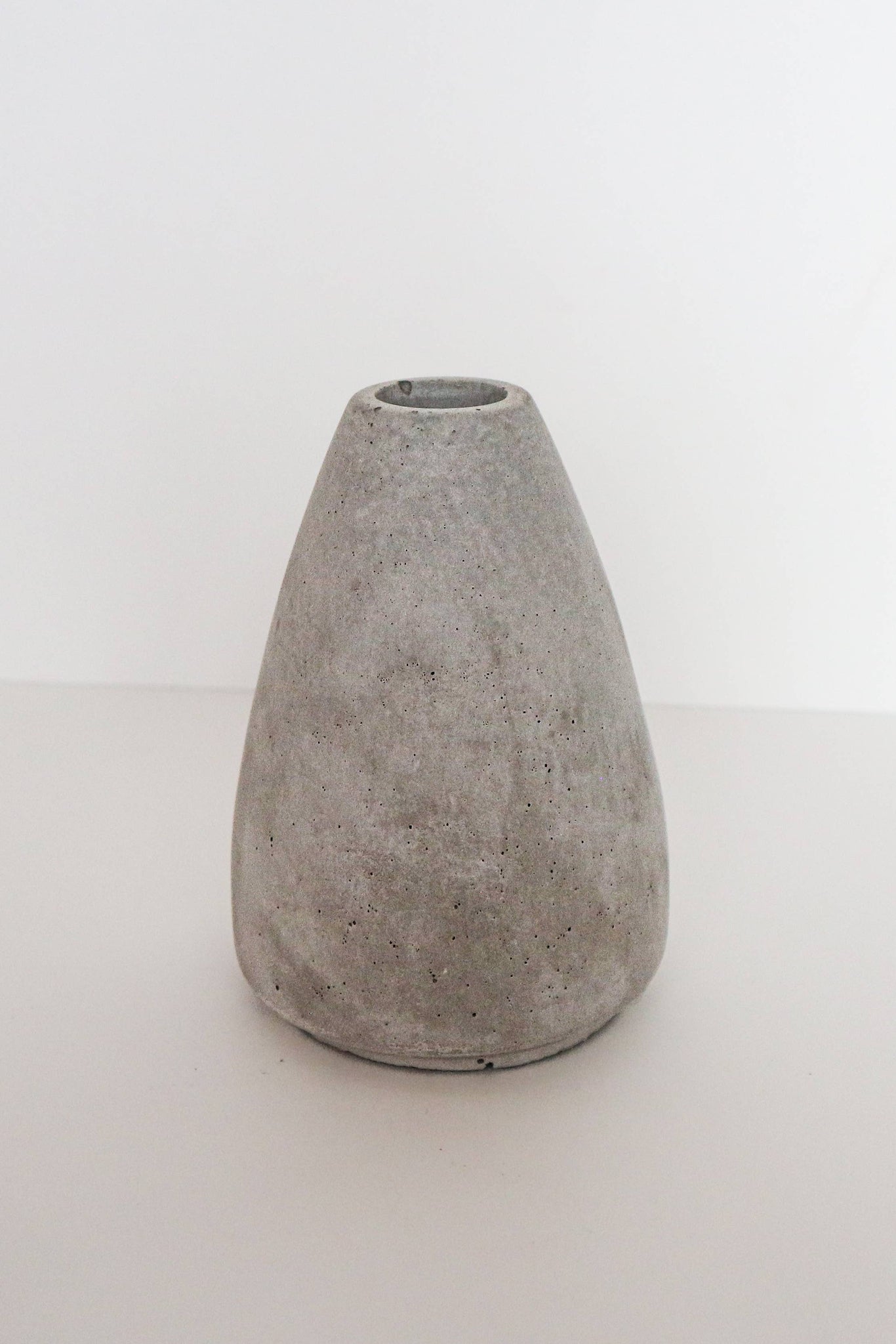Concrete vase on a white background