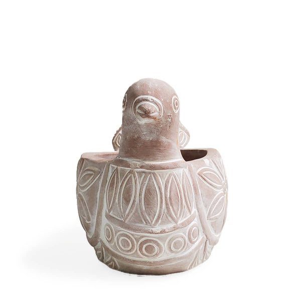 Terracotta dove-shaped planter with decorative patterns 