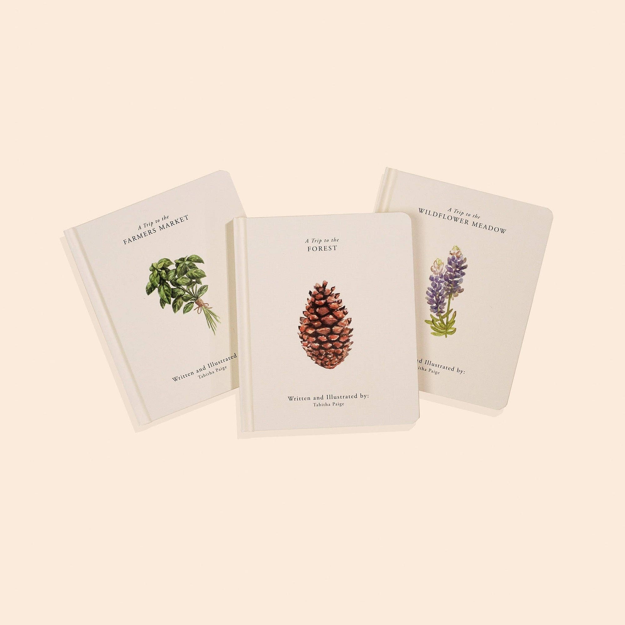 Three books with nature-themed illustrations 