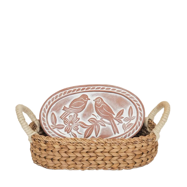 Decorative bread warming plate with bird design in a wicker basket 