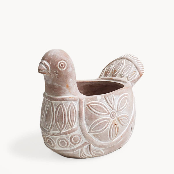 Terracotta bird-shaped planter with decorative patterns