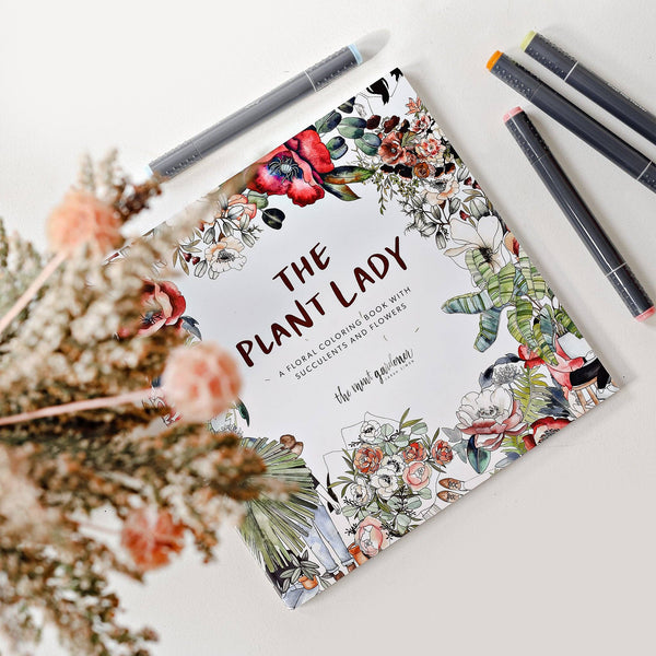 Coloring book titled 'The Plant Lady' styled with markers and dried flowers 